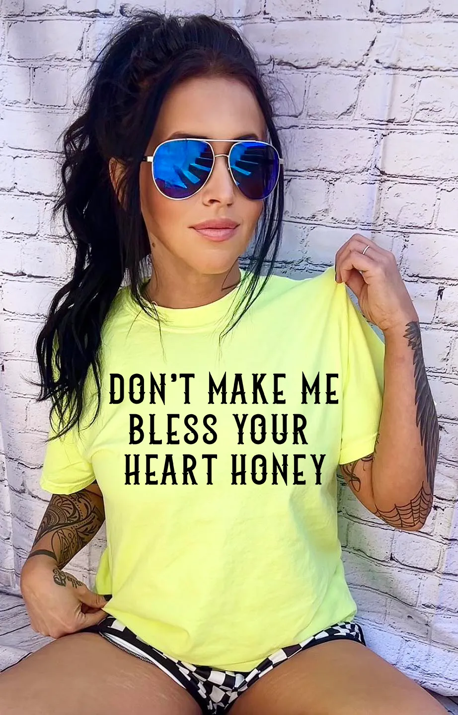 The neon Don’t Make Me Bless Your Heart Honey Collection on Comfort Colors or Beach Wash Graphic Tees // checkered shorts and joggers sold separately