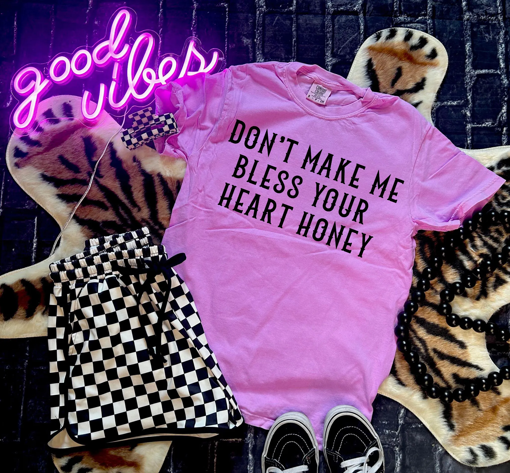 The neon Don’t Make Me Bless Your Heart Honey Collection on Comfort Colors or Beach Wash Graphic Tees // checkered shorts and joggers sold separately